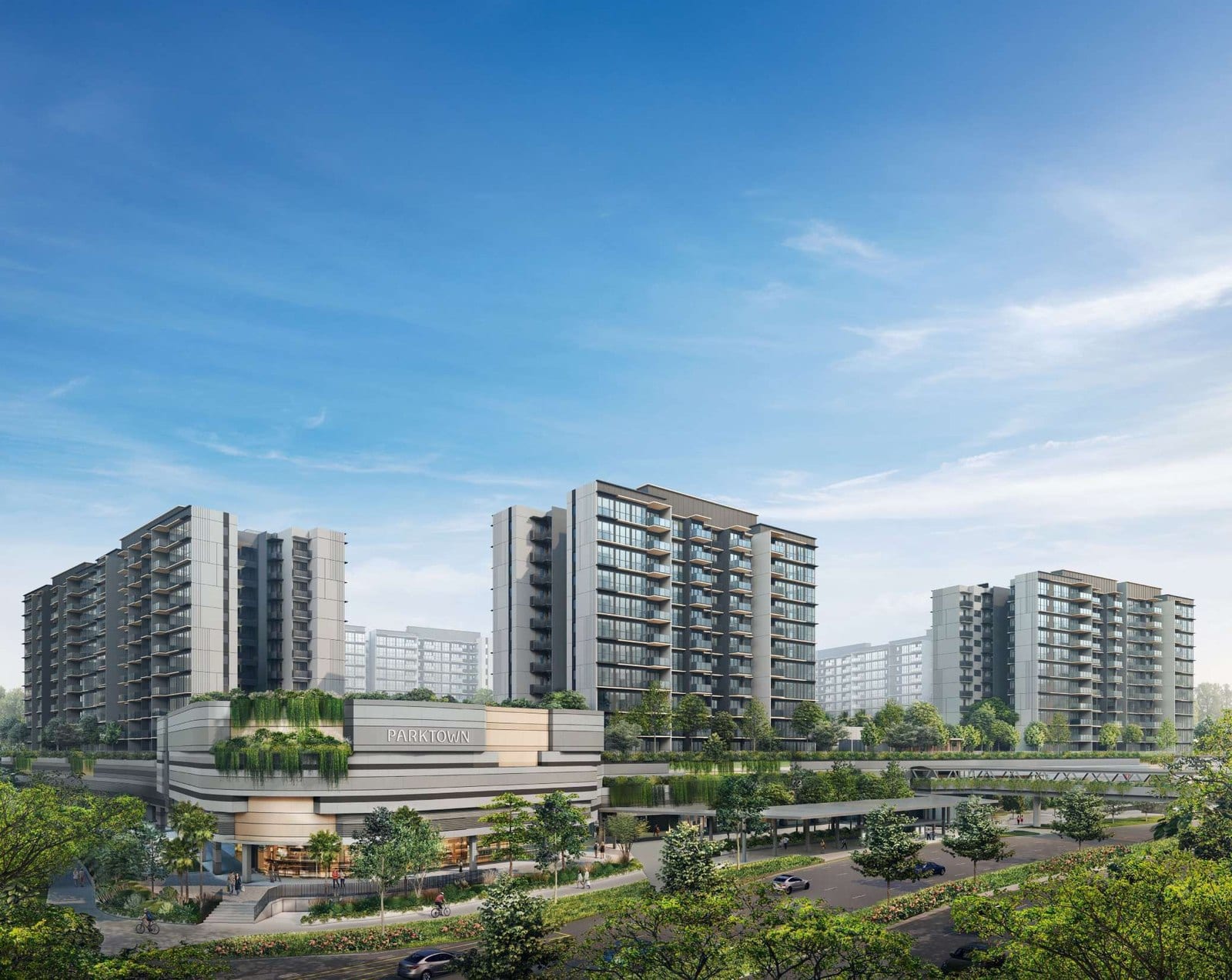 Artist's impression of the Parktown Residence towers rising above the landscaped PARKTOWN retail mall podium and tree-lined streetscape in Tampines North, Singapore.