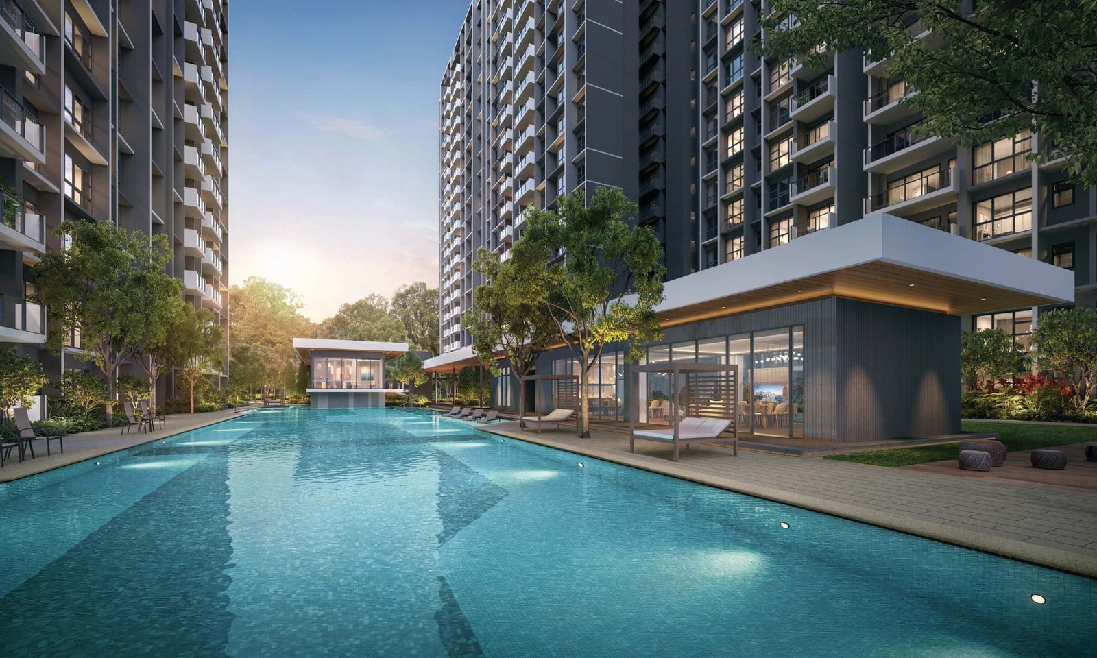 Otto Place's executive-condo towers above the resort pool at dusk, Tengah (District 24).