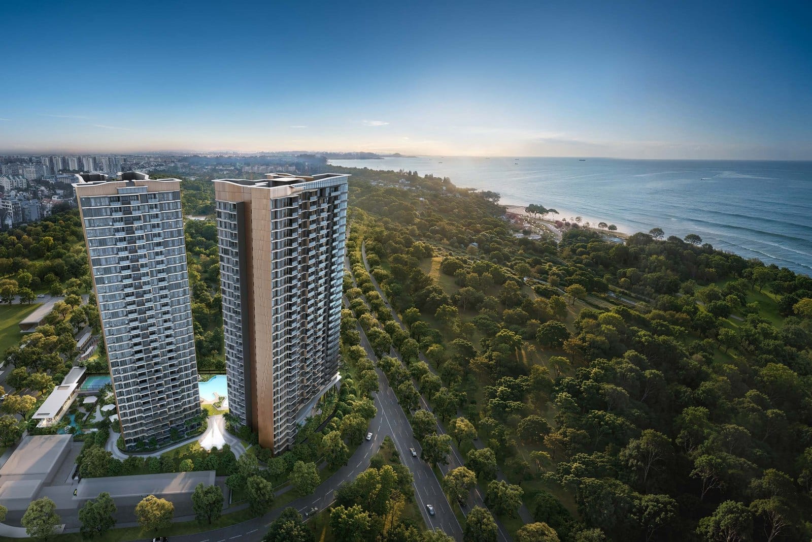 Daytime aerial render of Vela Bay's two residential towers beside the East Coast greenery and beachfront, with the sea stretching to the horizon, in District 16.
